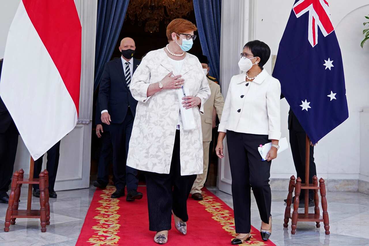 Marise Payne and Peter Dutton walk with their Indonesian counterpart Retno Marsudi