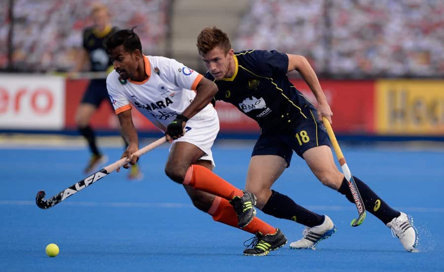 Australia’s Tristan White shadows India’s Danish Mujtaba during their Champions Trophy game at Lee Valley Hockey and Tennis Centre, London, 16th June 2016.