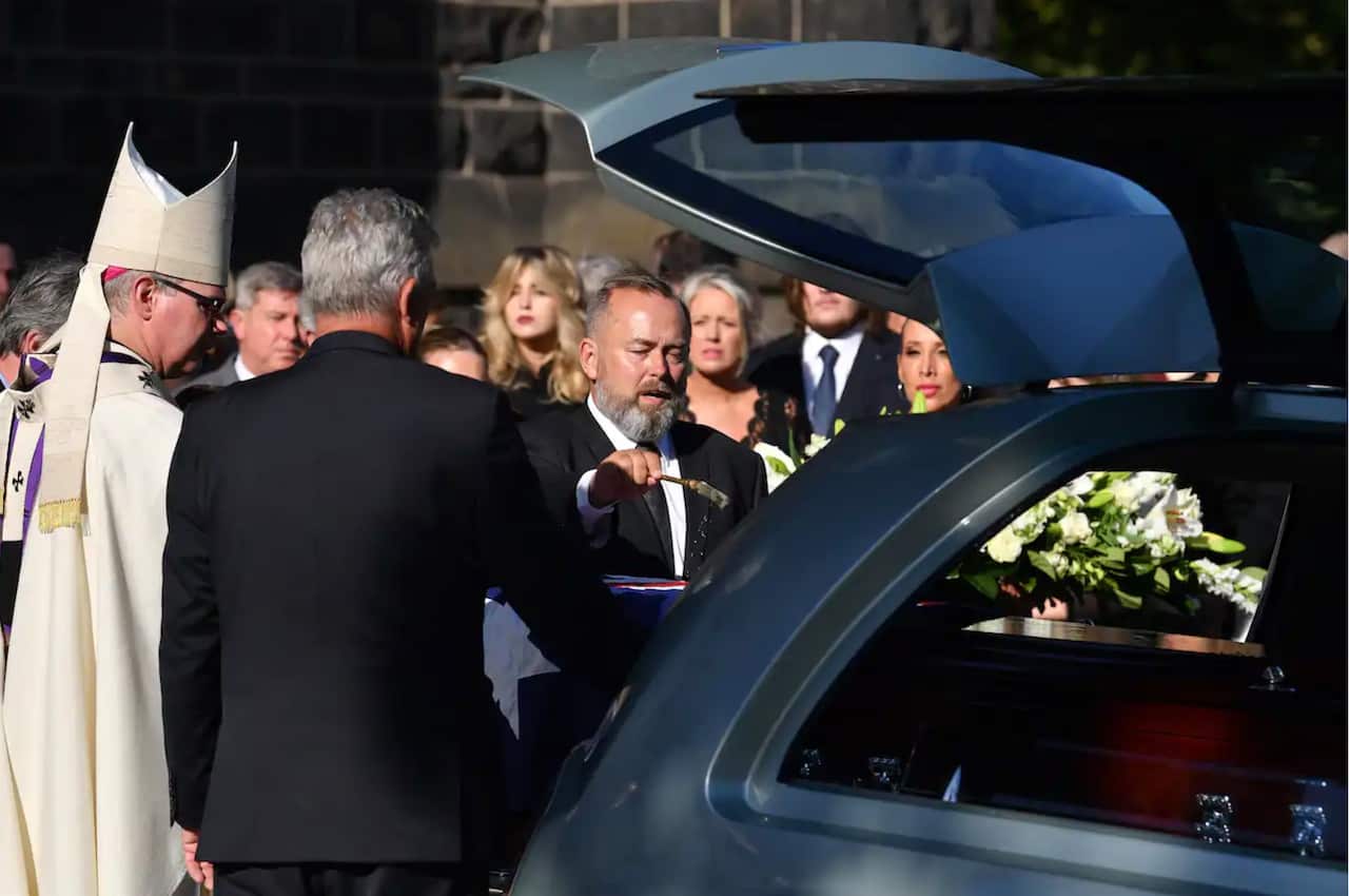 Andrew Landeryou, the husband of late Senator Kimberley Kitching, as pallbearers carry the casket during the funeral service for Senator Kimberley Kitching at St Patrick's Cathedral in Melbourne.