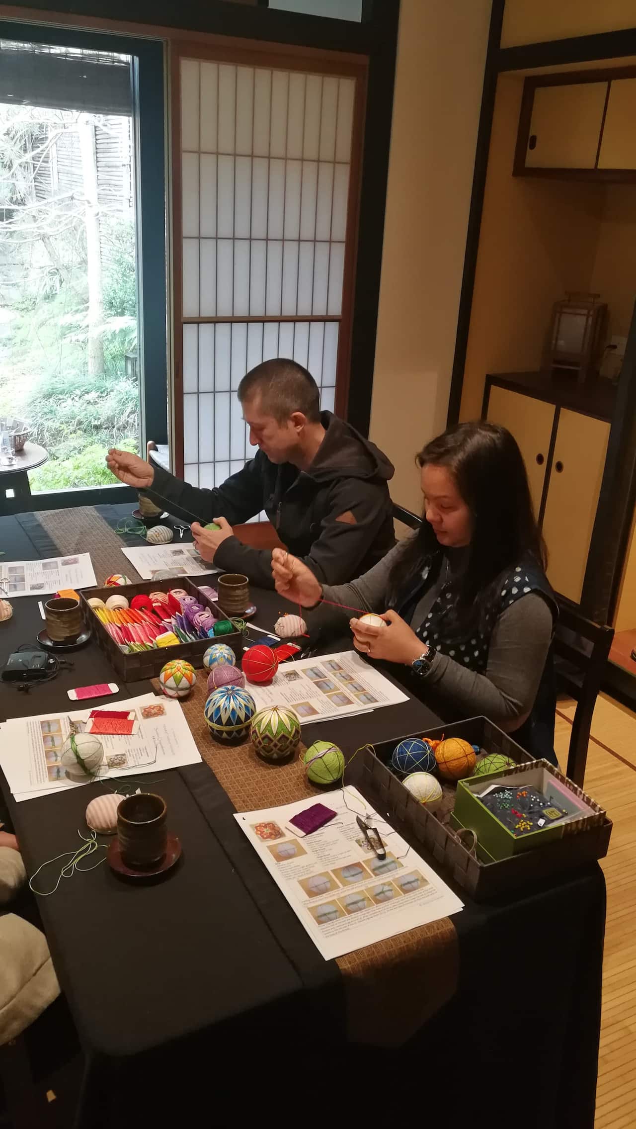 Participants take part in a Japanese temari ball making workshop in Sydney. The workshop is run by a Japanese artist Chihiro Kownacki.