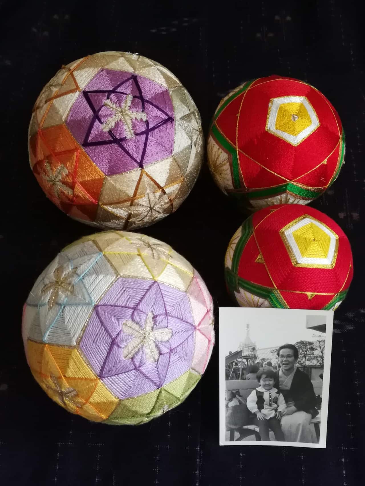 Two Japanese temari balls (bottom) were made by a Sydney-based Japanese artist Chihiro Kownacki. The two at the top were made by her grandmother.