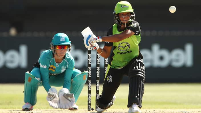 Harmanpreet Kaur of the Thunder hits for six during the Women's Big Bash League (WBBL) match between Sydney Thunder and Brisbane Heat.