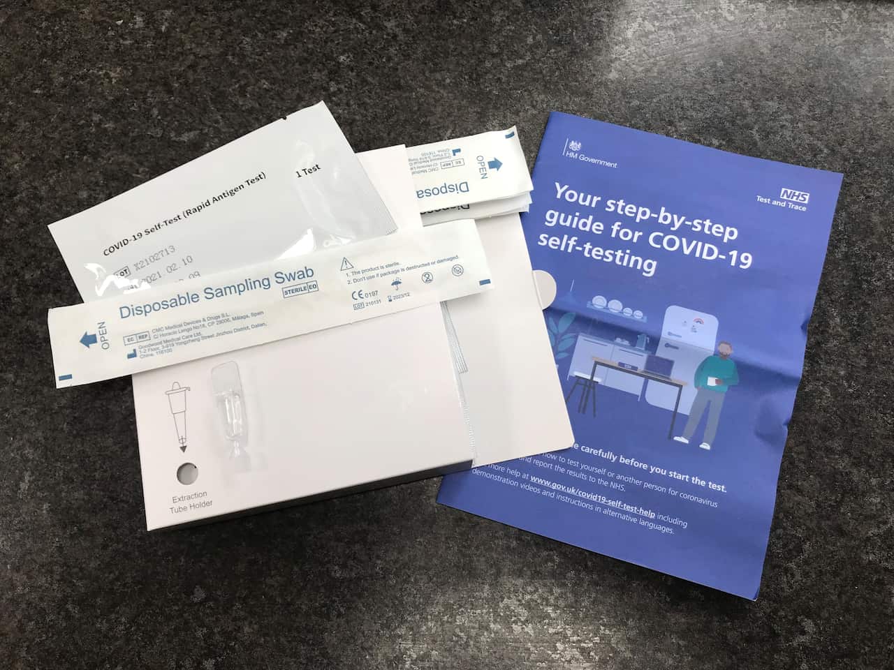 A package of seven NHS Test and Trace COVID-19 rapid antigen self-testing kits which were received in the mail after being ordered online in the UK.