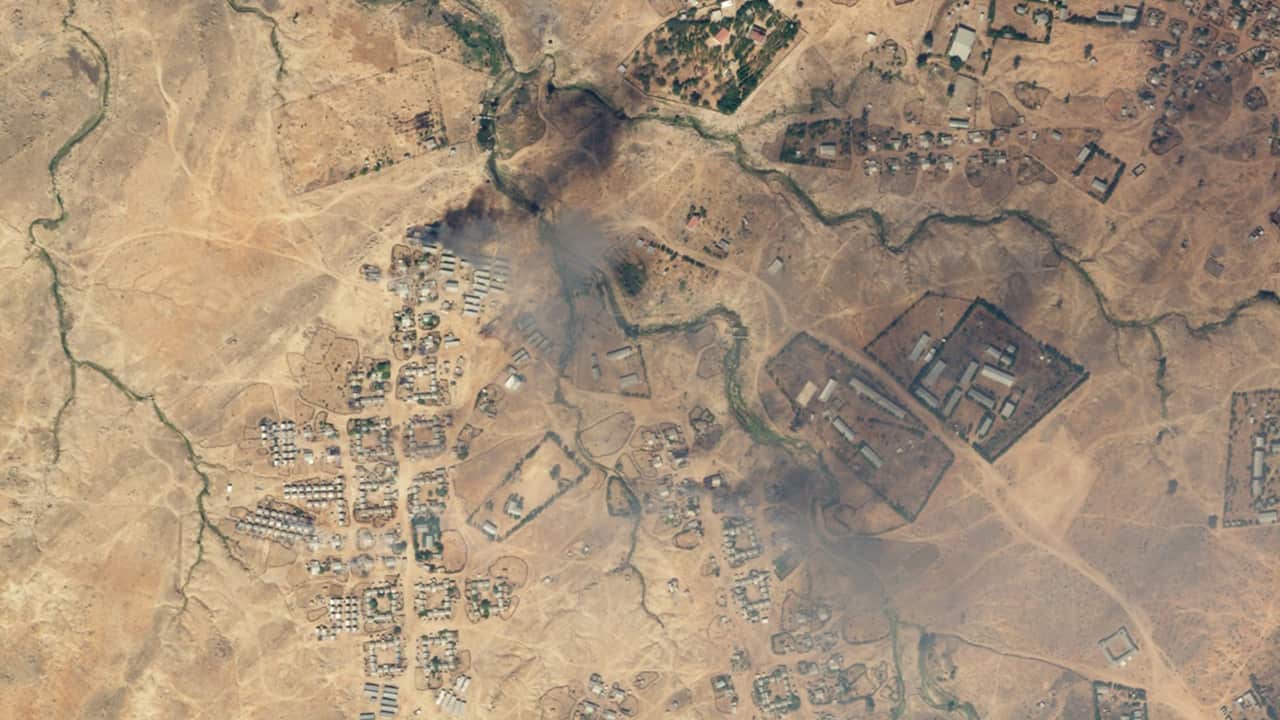 This aerial view illustrates the aftermath of an attack on the Hitsats refugee camp.