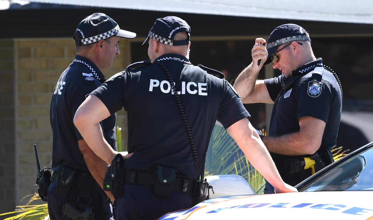 Police are seen at the home of murder victim Kelly Wilkinson on the Gold Coast, 21 April, 2021.