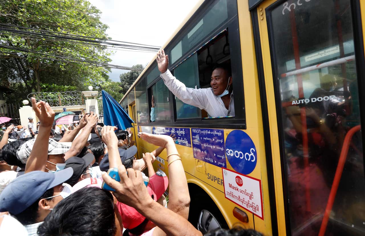 Released prisoners from the bus greet with their relatives and friends after being granted amnesty, outside the Insein Prison in Yangon, Myanmar, on 17 April.