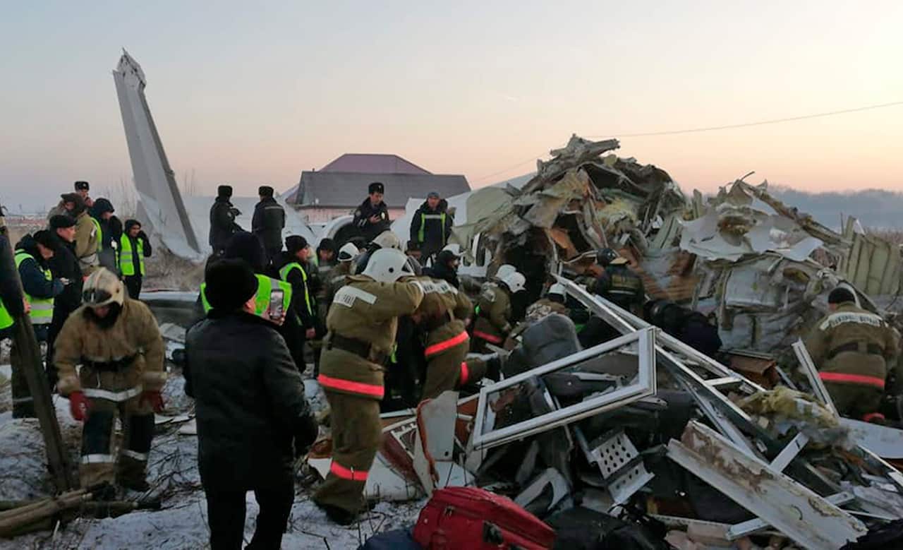 Rescuers get to work at a plane crash near Almaty International Airport, outside Almaty, Kazakhstan.