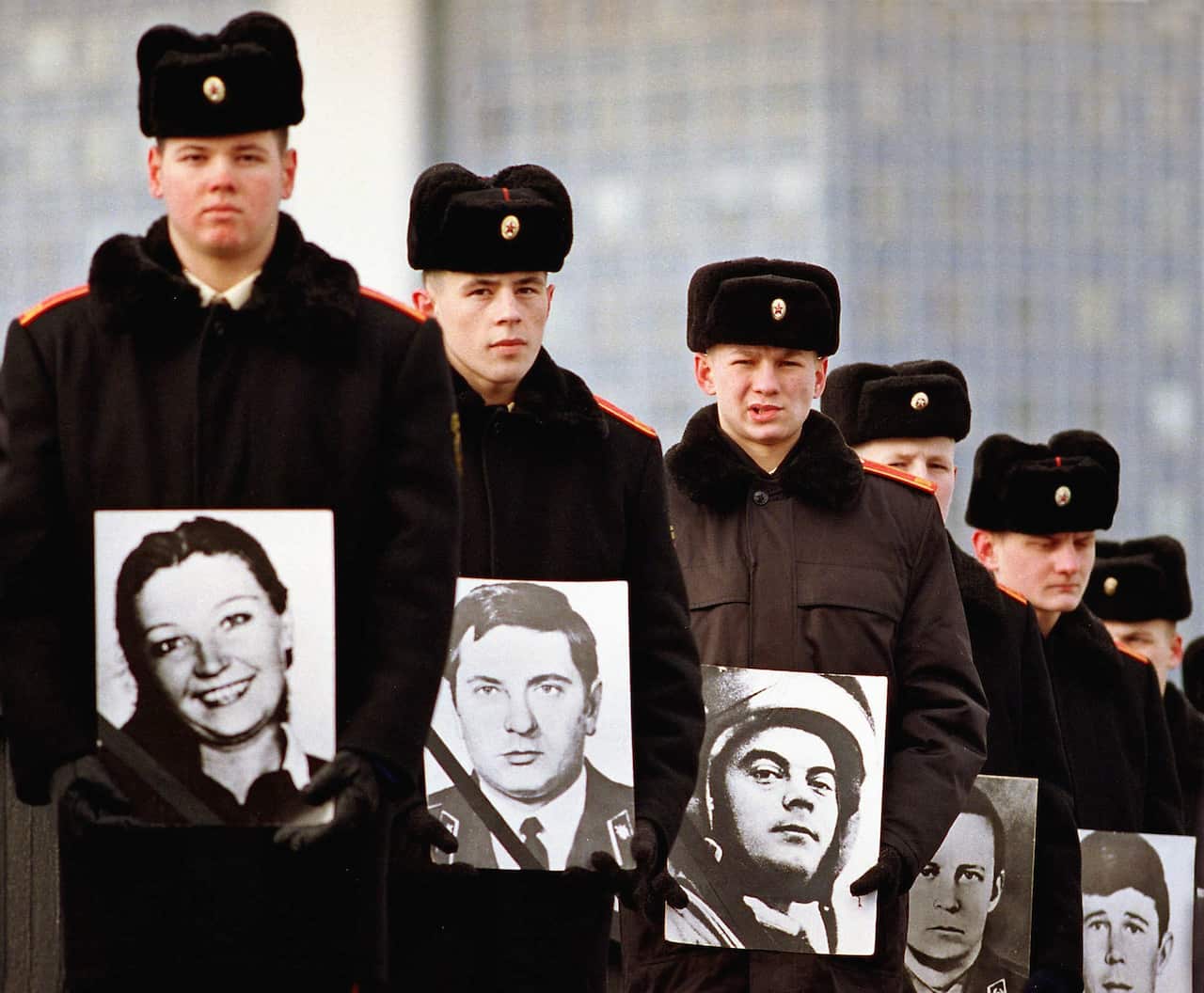 Young cadets hold portraits of Soviet military servicemen killed in the war in Afghanistan, during memorial ceremonies in Minsk, 15 February 2000. on the 11th anniversary of the Soviet Army's departure from Afghanistan.