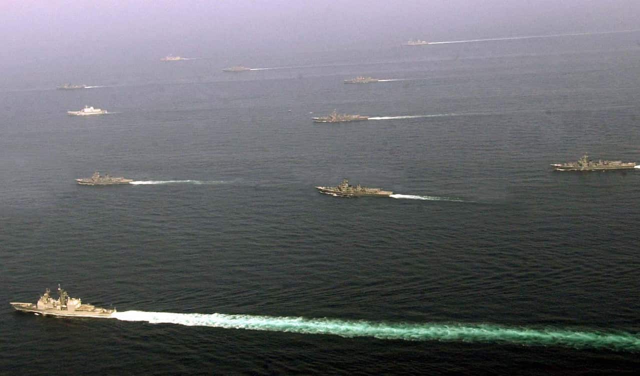 Indian and foreign warships, as part of the concluding ceremony of the International Fleet Review, at the high seas off Bombay Tuesday Feb. 20, 2001.