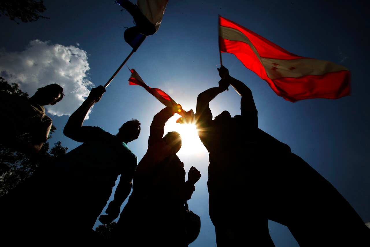 Supporters of Nepali Congress and Communist Party of Nepal along with other political parties participate in protest mass gathering in Kathmandu, Nepal, Friday, June 8, 2012.