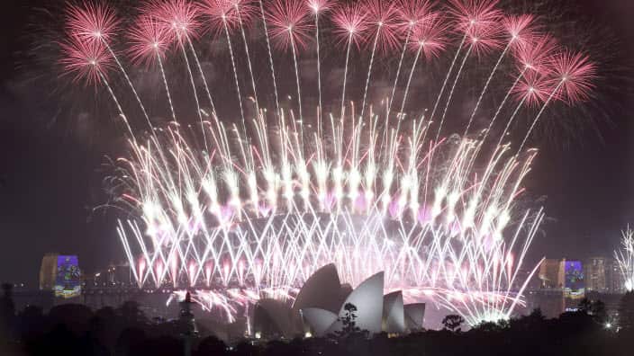 Fireworks explode over the Sydney Opera House and Harbour Bridge as New Year's celebrations are underway in Sydney, Australia, 