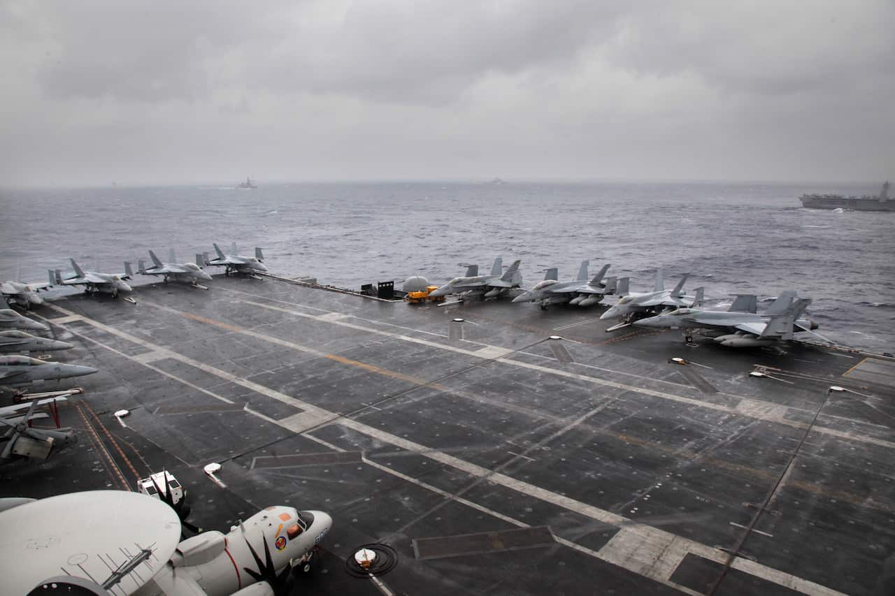 F18 aircrafts are parked on U.S. Navy aircraft carrier USS NIMITZ during the Malabar 2017 tri-lateral exercises between India, Japan and US in the Bay of Bengal, Monday, July 17, 2017. (AP Photo/Rishi Lekhi)