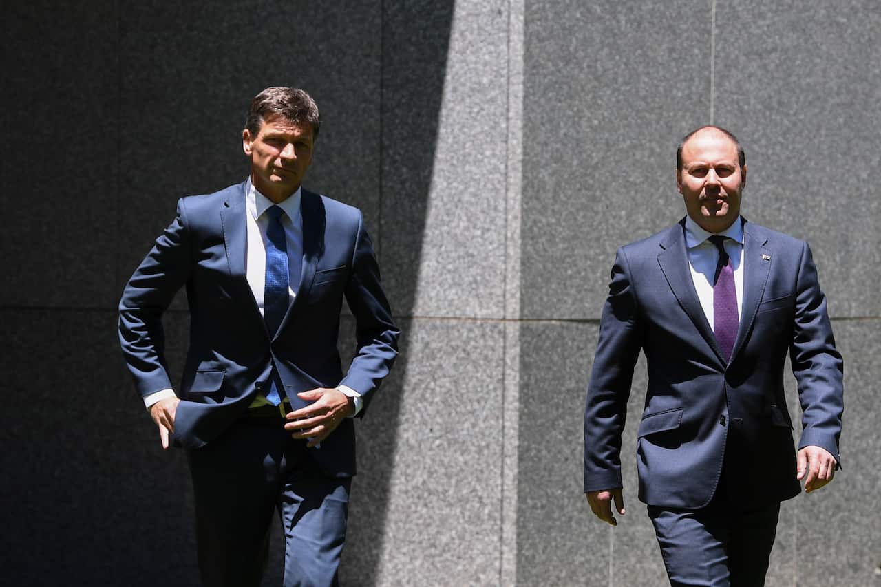 Australian Federal Treasurer Josh Frydenberg (right) and Australian Energy Minister Angus Taylor arrive to speak to the media during a press conference 