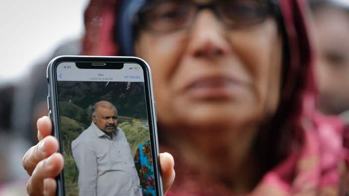 Akhtar Khokhr, 58, shows a picture of her  husband Mehaboobbhai Khokhar