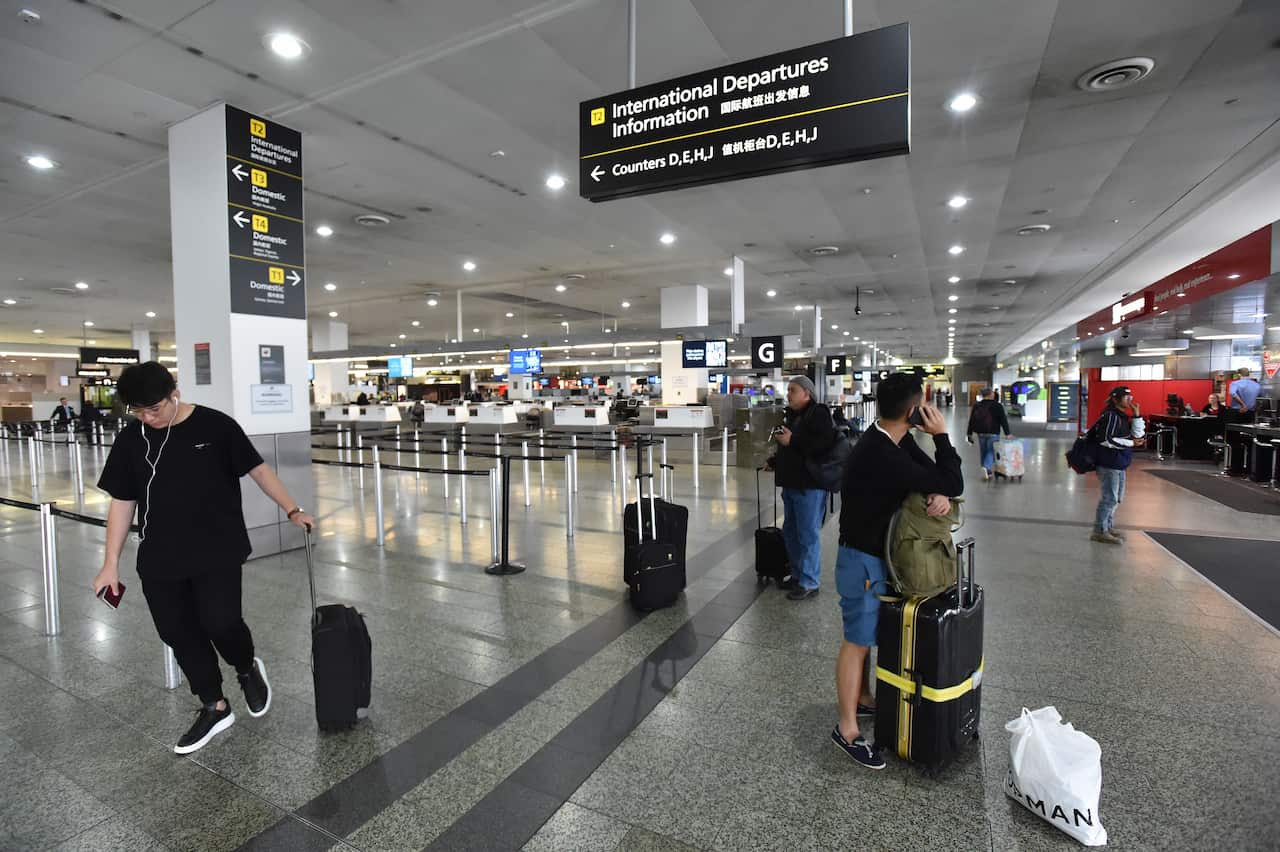 Passengers are seen in the International departures lounge at Melbourne Airport, Monday, April 29, 2019. Passengers at international airports across Australia are being delayed by a computer systems outage.(AAP Image/James Ross) NO ARCHIVING