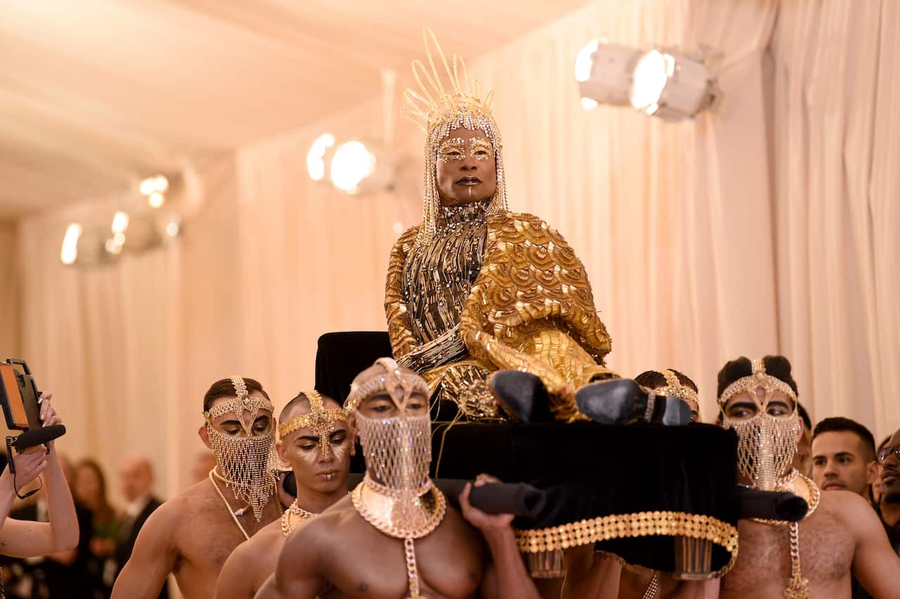 Billy Porter is carried on the red carpet as he arrives at The Metropolitan Museum 