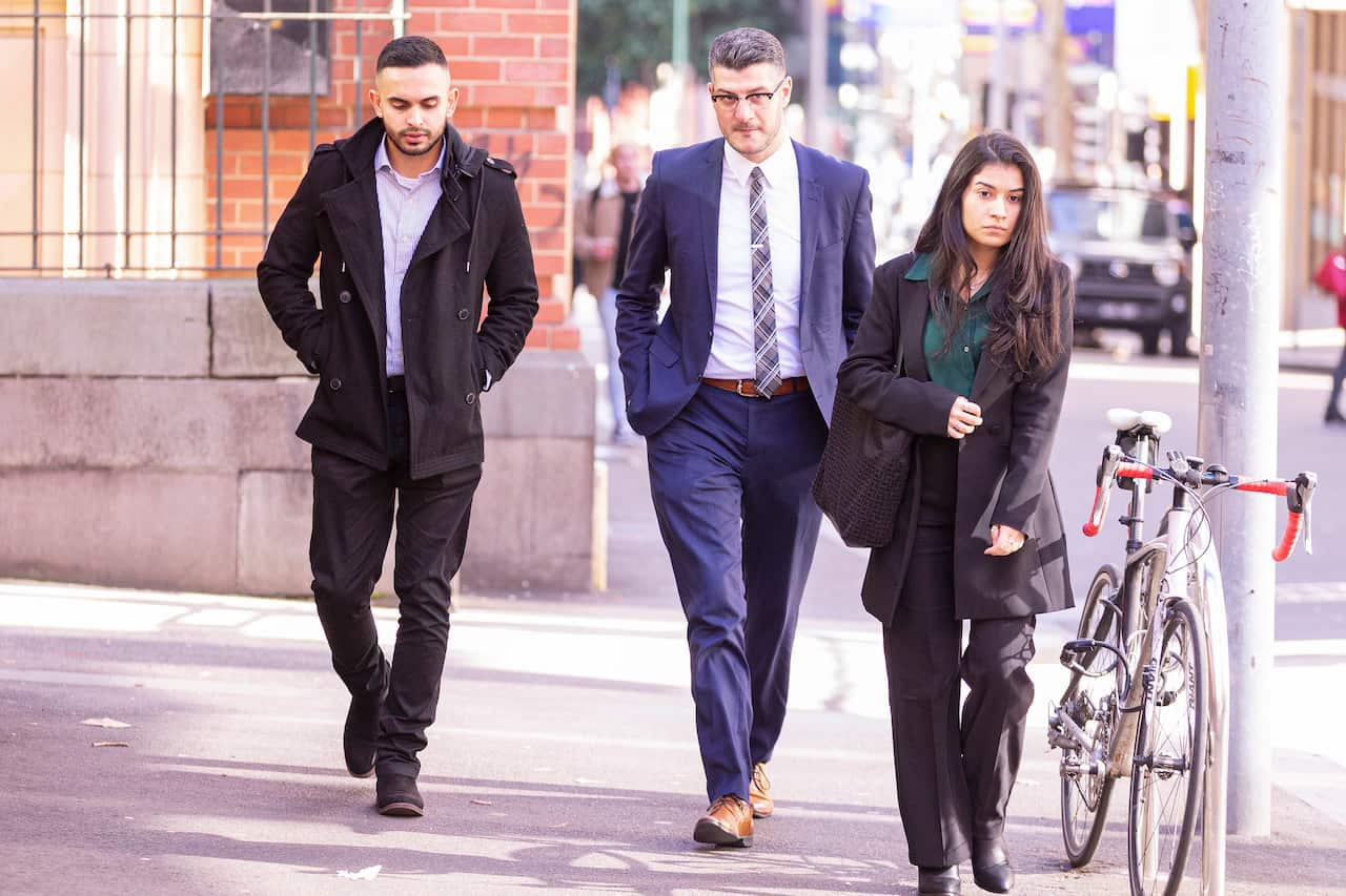 Eathan Cruse (left) arrives at the Supreme Court of Victoria in Melbourne, Monday, July 22, 2019. Cruse is suing police, alleging he was assaulted during a counter-terror raid in 2014. (AAP Image/Daniel Pockett) NO ARCHIVING
