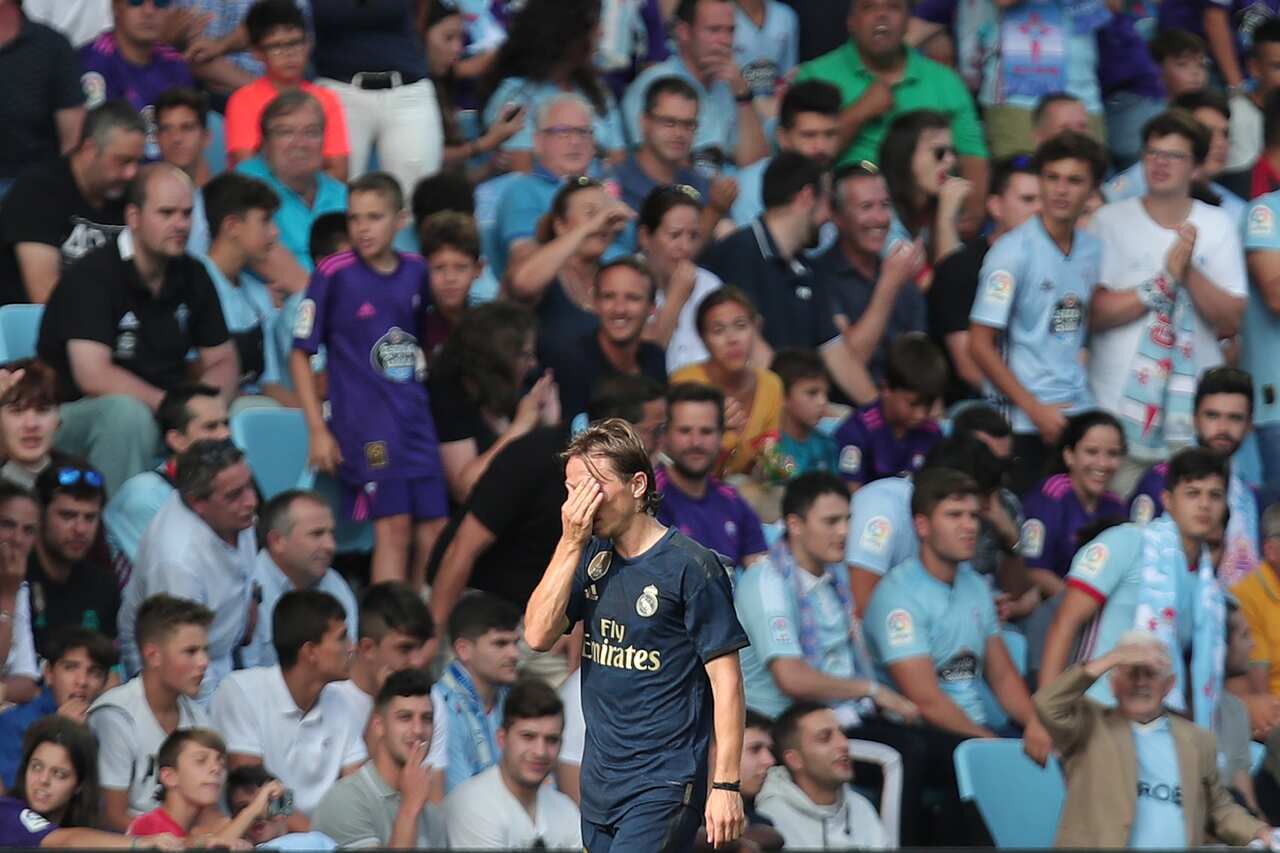 Real Madrid's Luka Modric reacts after receiving a red card by the referee during La Liga soccer match between Celta and Real Madrid at the Balaídos Stadium in Vigo, Spain, Saturday, Aug. 17, 2019. (AP Photo/Luis Vieira)