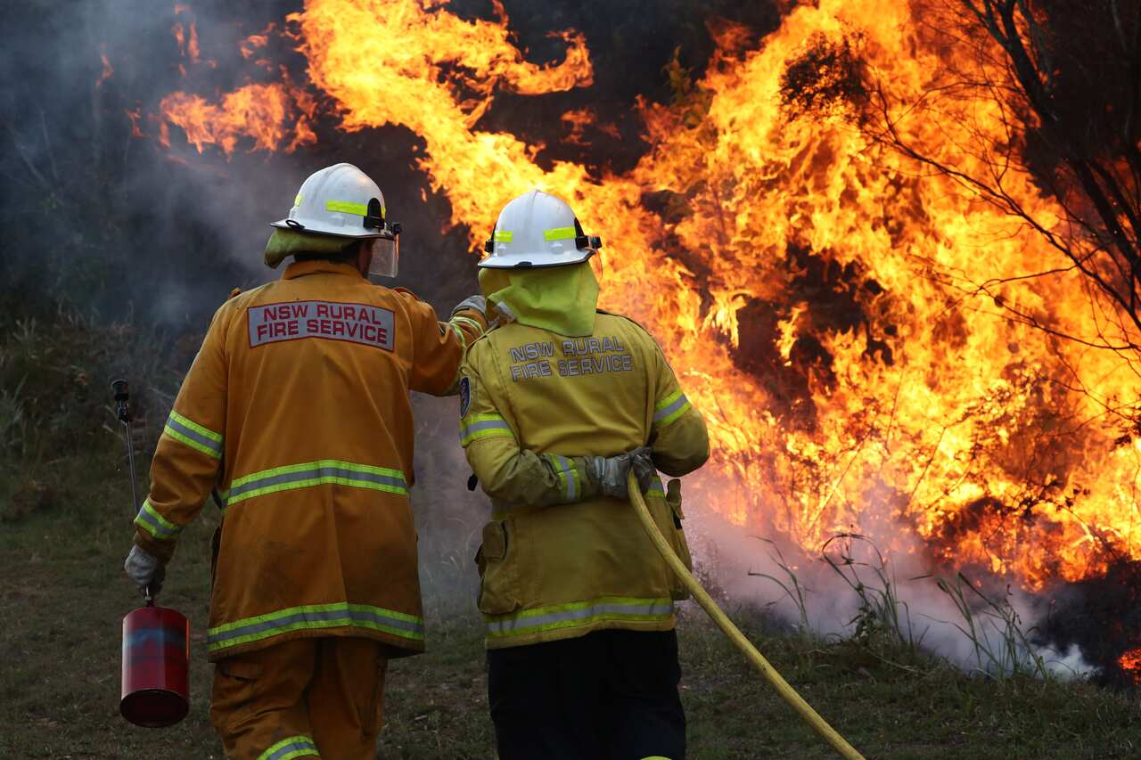Firefighters  battle bushfires in Angourie, northern New South Wales, Tuesday, September 10, 2019. (AAP Image/Jason O'Brien) NO ARCHIVING