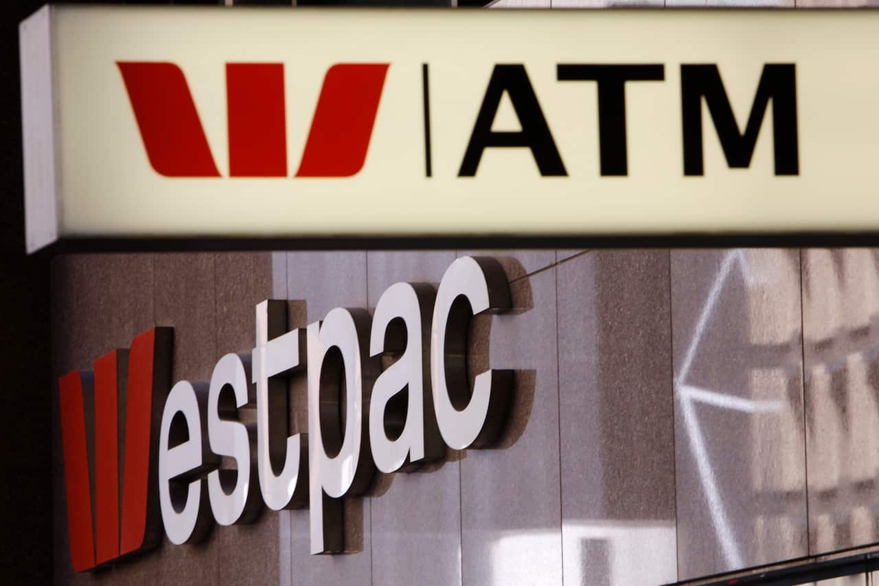 In this Nov. 3, 2010, file photo, signs are displayed at a Westpac branch in Sydney, Australia