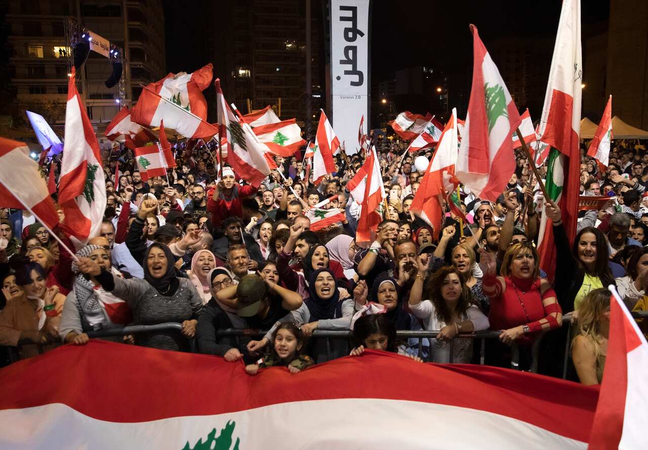 Lebanese Protesters shout slogans and wave their national flags as they are demonstrating in Martyr Square, Beirut, Lebanon, 24 November 2019.
