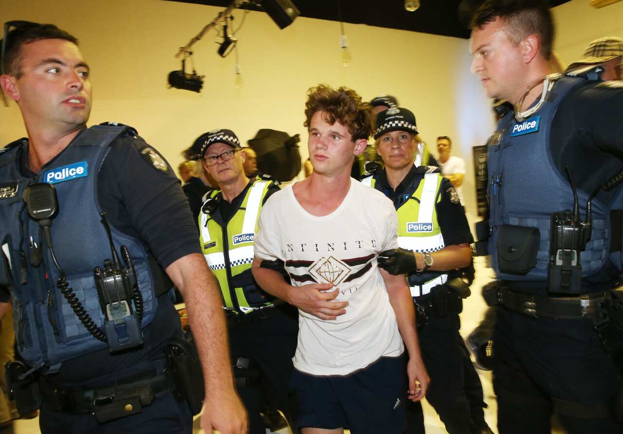 A left-wing activist is arrested after smashing an egg over the head of Senator Fraser Anning after he addressed a political meeting in Moorabbin, Melbourne