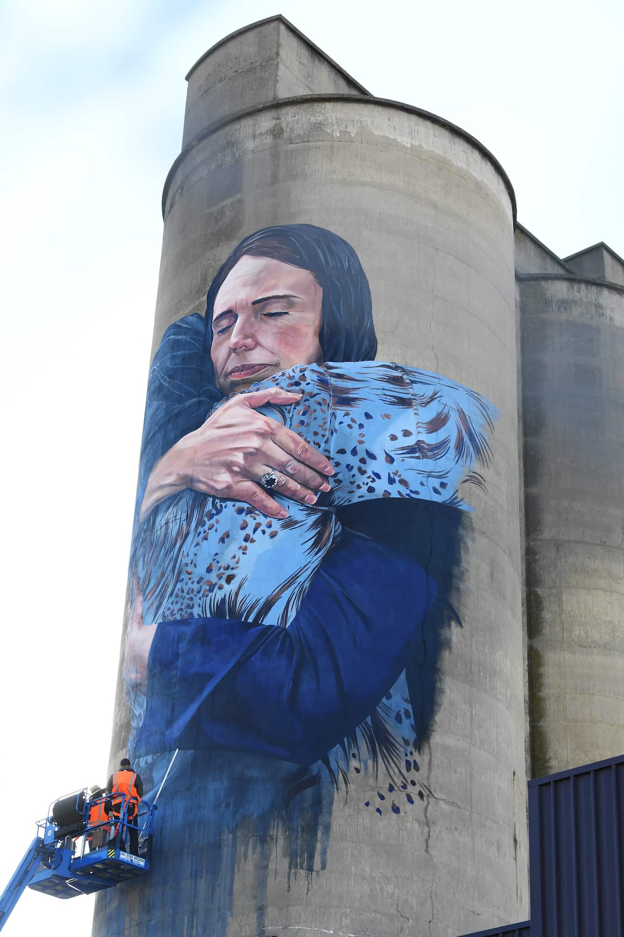 view of the mural by street artist Loretta Lizzio depicting New Zealand's Prime Minister Jacinda Ardern embracing a woman is seen in Brunswick, Melbourne,