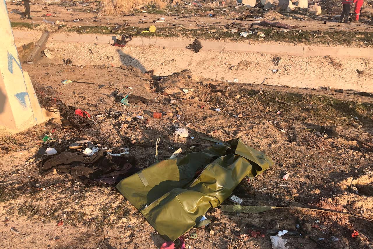 Debris is seen from a plane crash on the outskirts of Tehran, Iran, Wednesday, Jan. 8, 2019. 