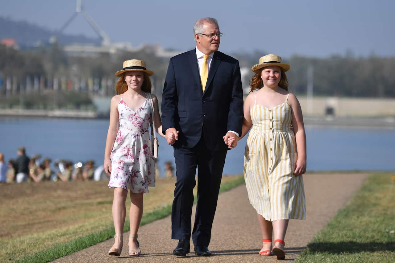 Prime Minister Scott Morrison and daughters Abbey and Lily arrive at an Australia Day Citizenship Ceremony and Flag Raising event in Canberra, Sunday, January 26, 2020. (AAP Image/Mick Tsikas) NO ARCHIVING