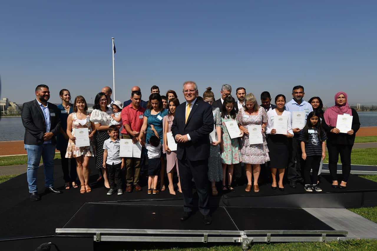 PM Scott Morrison with new citizens during an Australia Day Citizenship Ceremony in Canberra, Jan 26, 2020, before Covid-19 restrictions.