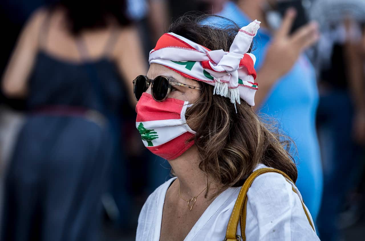 epa08469959 Anti-government protestors during a mass protest against the economic and financial crisis, and to demand early parliamentary elections, in Beirut, Lebanon, 06 June 2020. EPA/NABIL MOUNZER