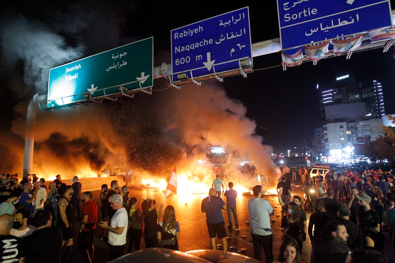 Anti-government protesters burn tires as they block the highway during a protest in Antelias area north of Beirut, Lebanon, 11 June 2020. EPA/WAEL HAMZEH