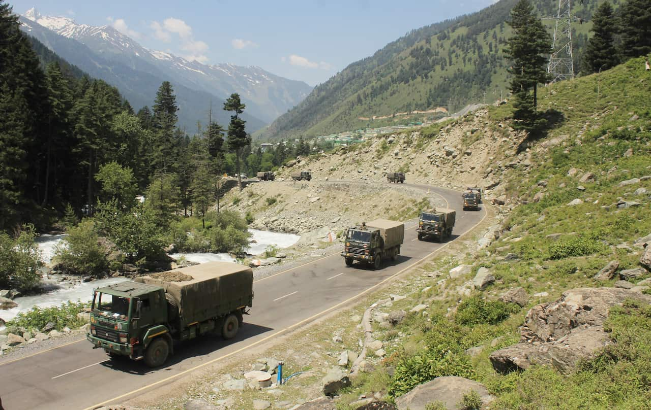 An Indian army convoy moved along the Srinagar-Ladakh highway on Thursday, following deadly clashes along the disputed border with china. (Photo by Sajad Hameed/Pacific Press/Sipa USA)