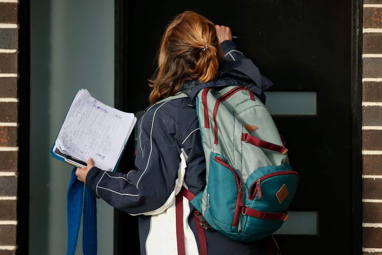 Victoria State Government Health and Human Services people knock on doors in Broadmeadows to check if people have any symptoms of COVID19 and would like a test, in Melbourne, Thursday, June 25, 2020. The ADF and other states have been called in to help Vi
