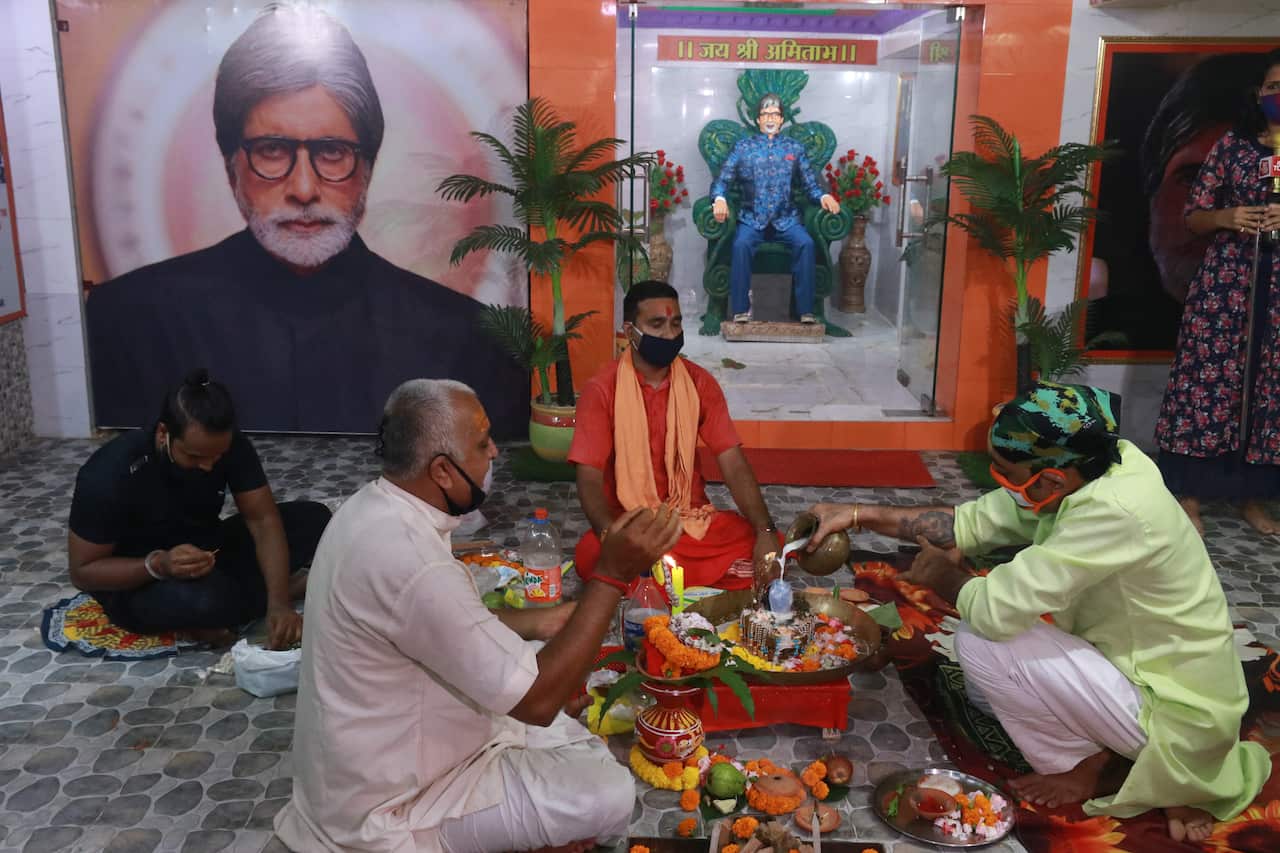 Fan of Bollywood actor Amitabh Bachchan along Hindu priest perform haven for speedy recovery from COVID-19 in Kolkata city. (Photo by Dipa Chakraborty/Pacific Press/Sipa USA)