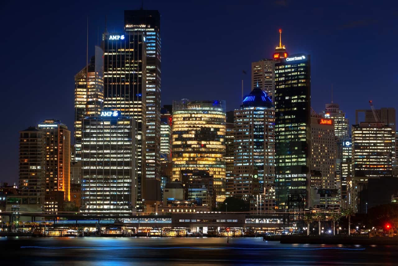 February 2020  - Architecture. First line of buildings in Sydney city CBD at sunset. Illuminated arch of the bridge reflecting in blurred waters Sydney, New South Wales, Australia (Photo by Sergi Reboredo/Sipa USA)