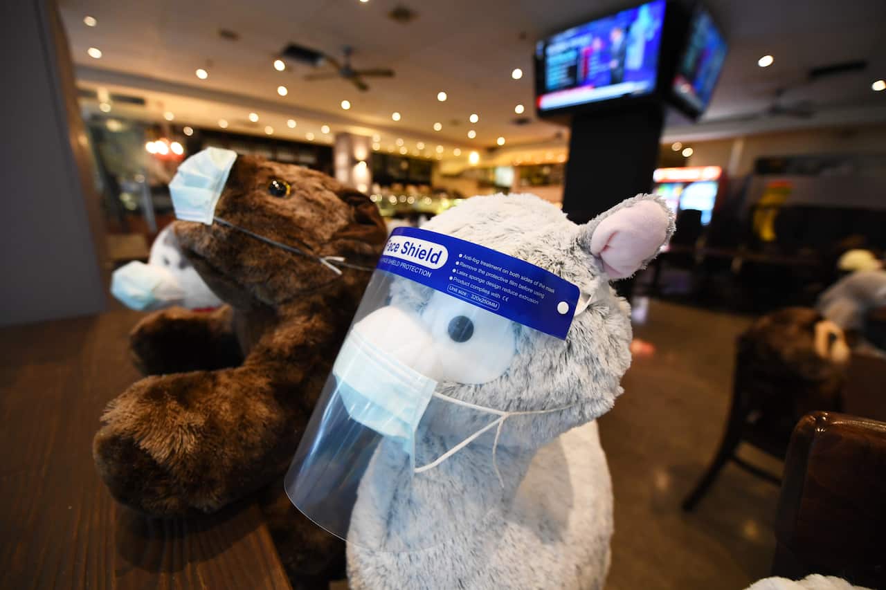 Soft toys used as a social distancing measure are seen in a cafe offering take-away in Melbourne, Tuesday, August 4, 2020. 