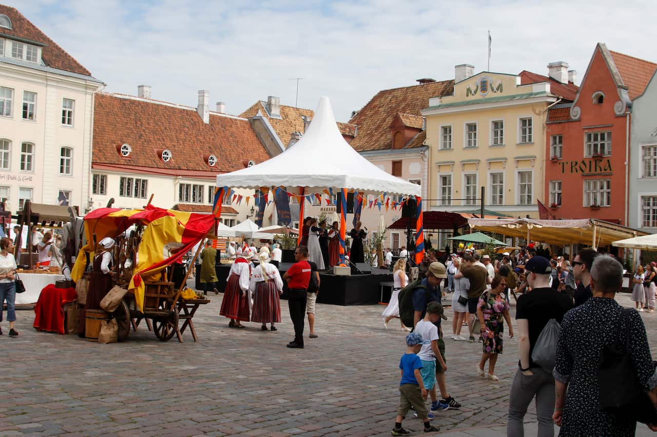 Visitors attend the 21st Medieval Days festival in Tallinn, Estonia, 16 August 2020.