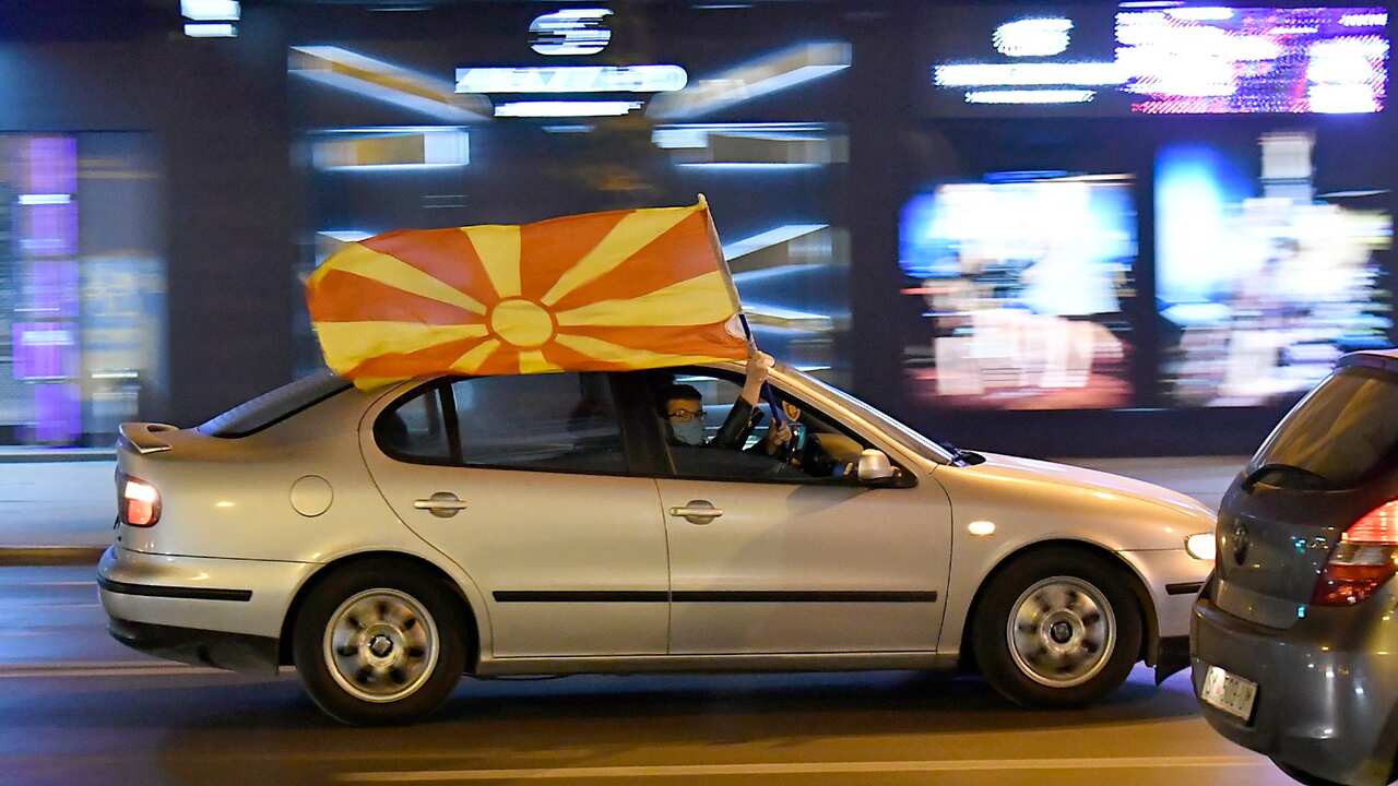 Football fans celebrate on the city streets , in Skoplje