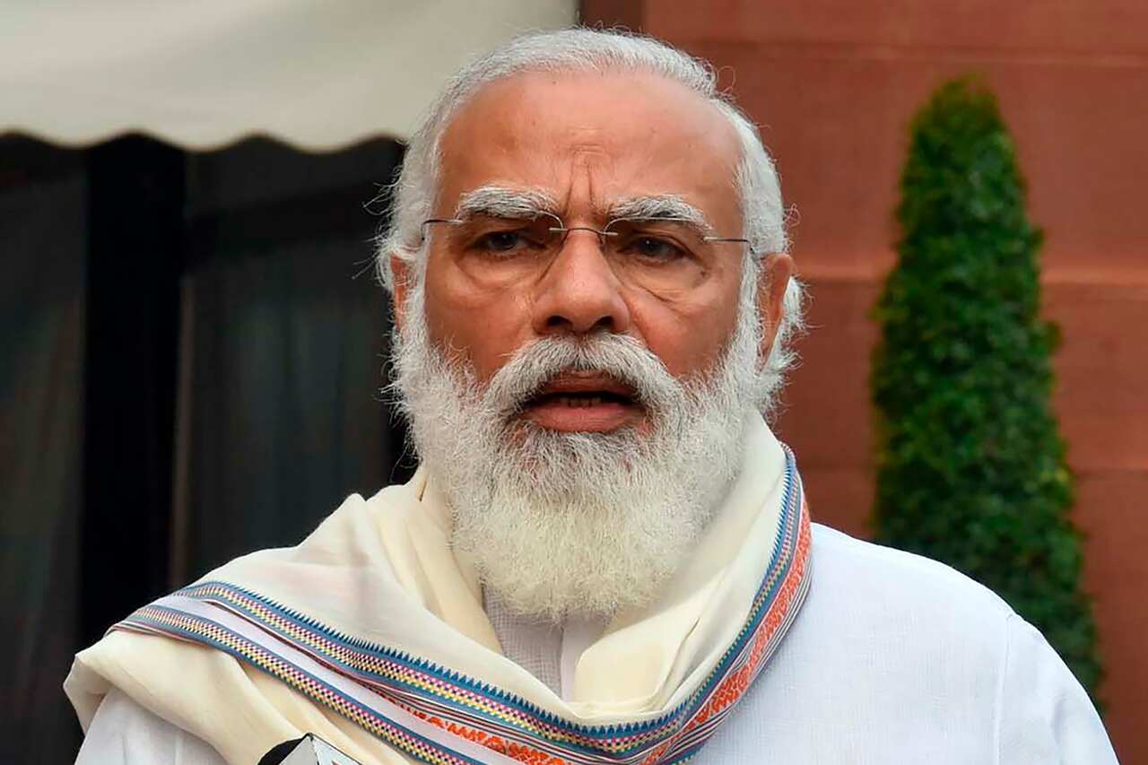 In this photo released by India Government Press Information Bureau, Indian Prime Minister Narendra Modi addresses the media as he arrives at the Parliament in New Delhi, India, Monday, Sept.14, 2020. Indian lawmakers have returned to Parliament after mor