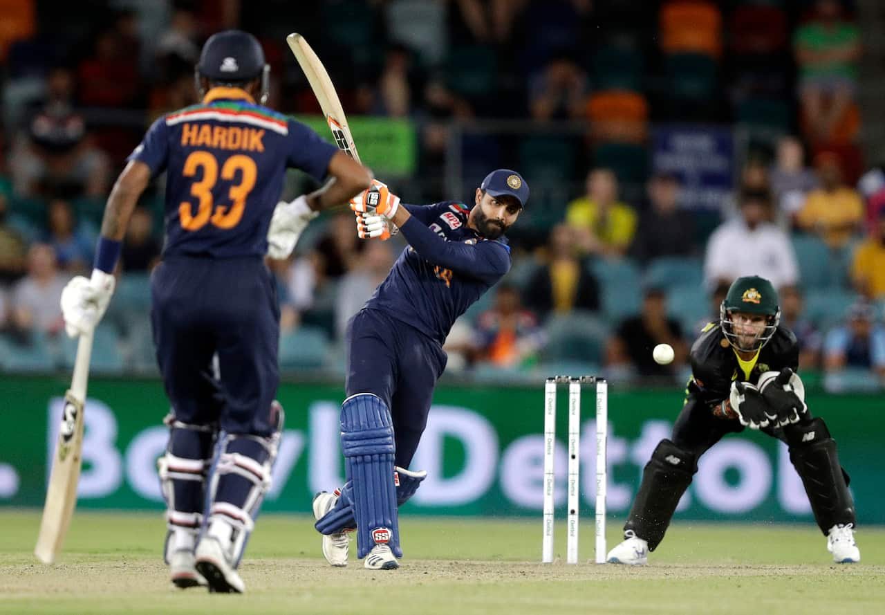 India's Ravindra Jadeja, center, bats against Australia during their T20 international cricket match at Manuka Oval, in Canberra, Australia, Friday, Dec 4, 2020. (AP Photo/Mark Baker)