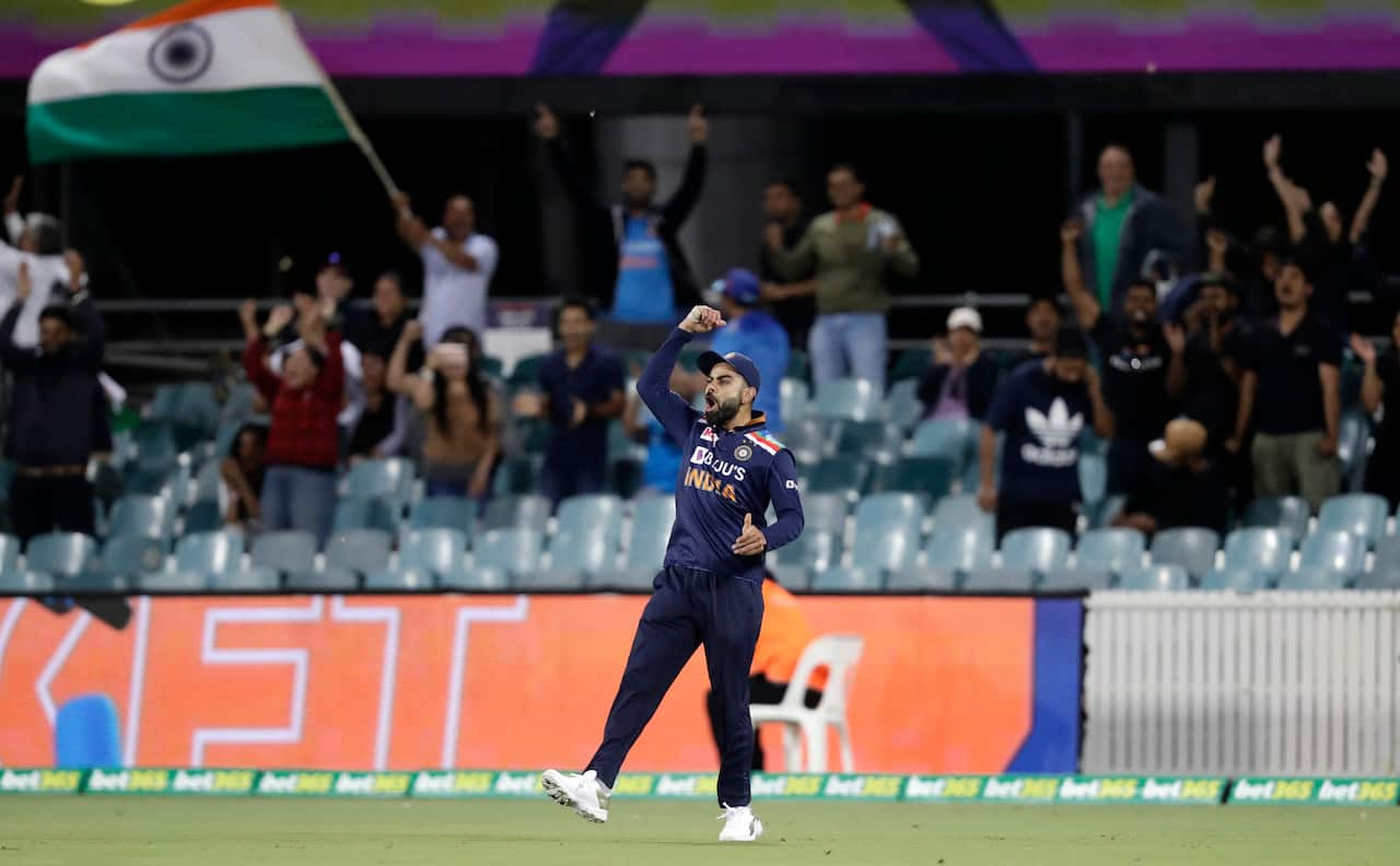 India's Virat Kohli celebrates after taking a catch to dismiss Australia's Matthew Wade during their T20 international cricket match at Manuka Oval, in Canberra, Australia, Friday, Dec 4, 2020. (AP Photo/Mark Baker)