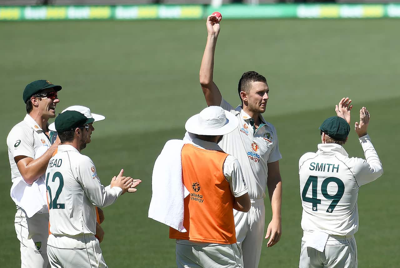 Australian bowler Josh Hazlewood shows the ball after taking his 5th wicket on day 3 of the first Test Match between Australia and India.