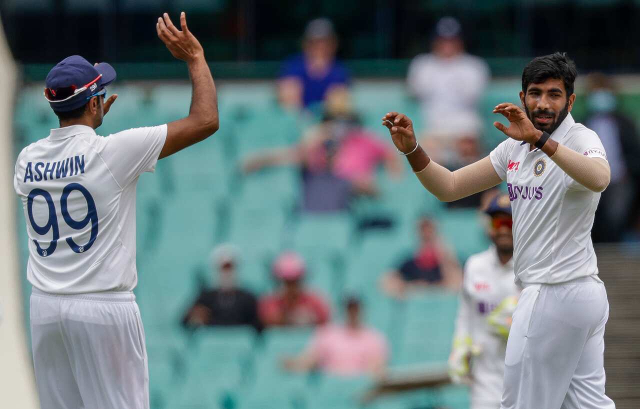 India's Jasprit Bumrah, right, is congratulated by teammate Ravichandran Ashwin