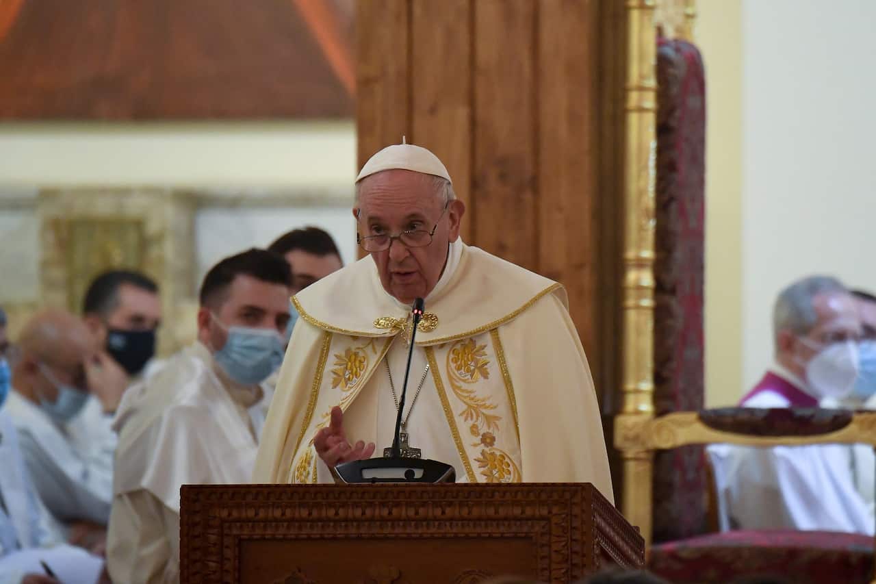 epa09057109 Pope Francis (C) officiates the Holy mass at the Chaldean Cathedral of 'Saint Joseph' in Baghdad, Iraq, 06 March 2021. Pope Francis is visiting Iraq for the Apostolic Journey from 05 to 08 March 2021. EPA/ALESSANDRO DI MEO