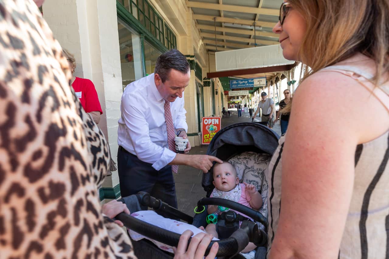 WA Premier Mark McGowan talks to members of the public outside an early voting centre in Kalgoorlie, 590km east Perth on Thursday, March 11, 2021. Western Australia is holding a State Election on March 13. (AAP Image/Richard Wainwright) NO ARCHIVING