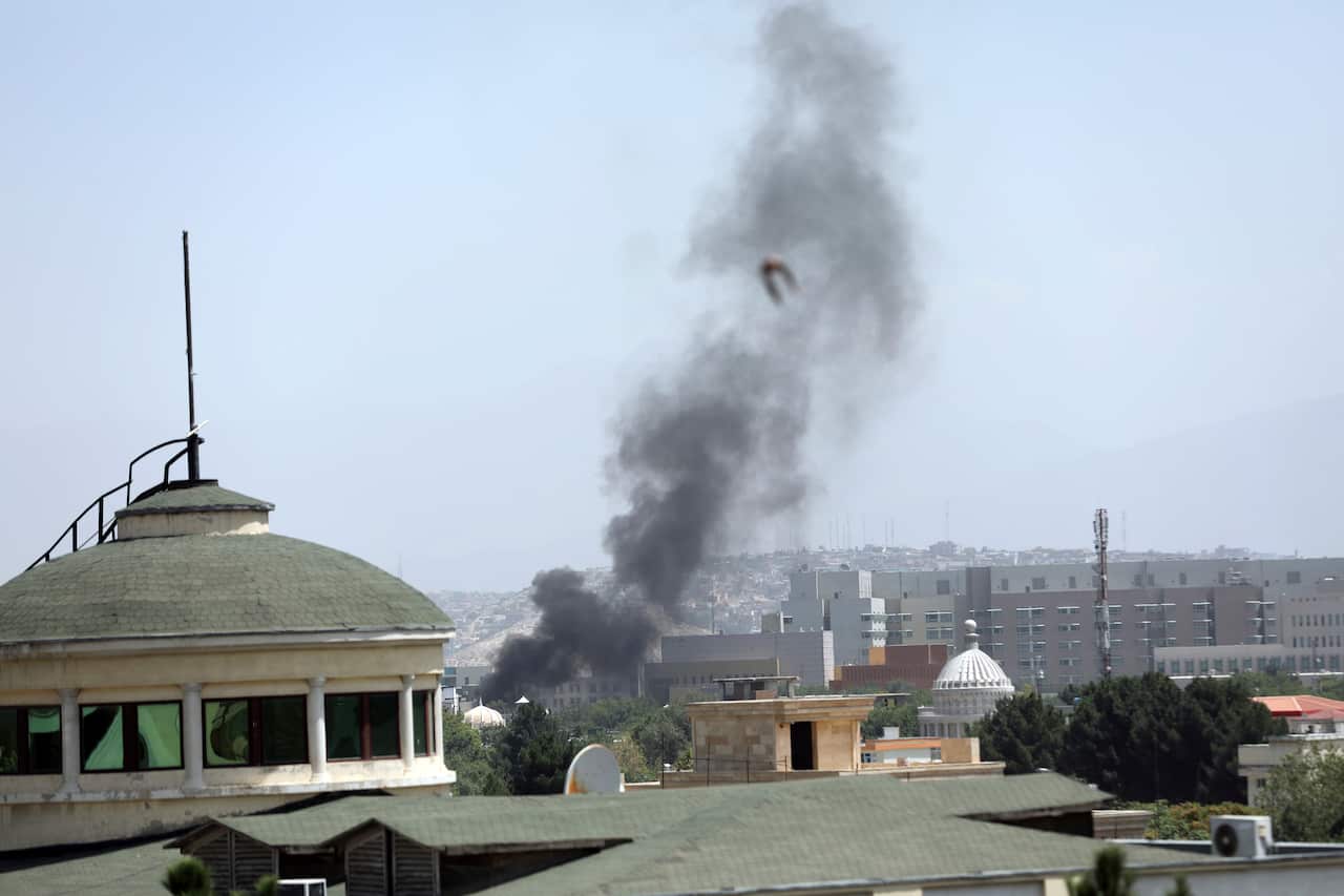 Diplomatic vehicles leave the compound amid the Taliban advanced on the Afghan capital. 
