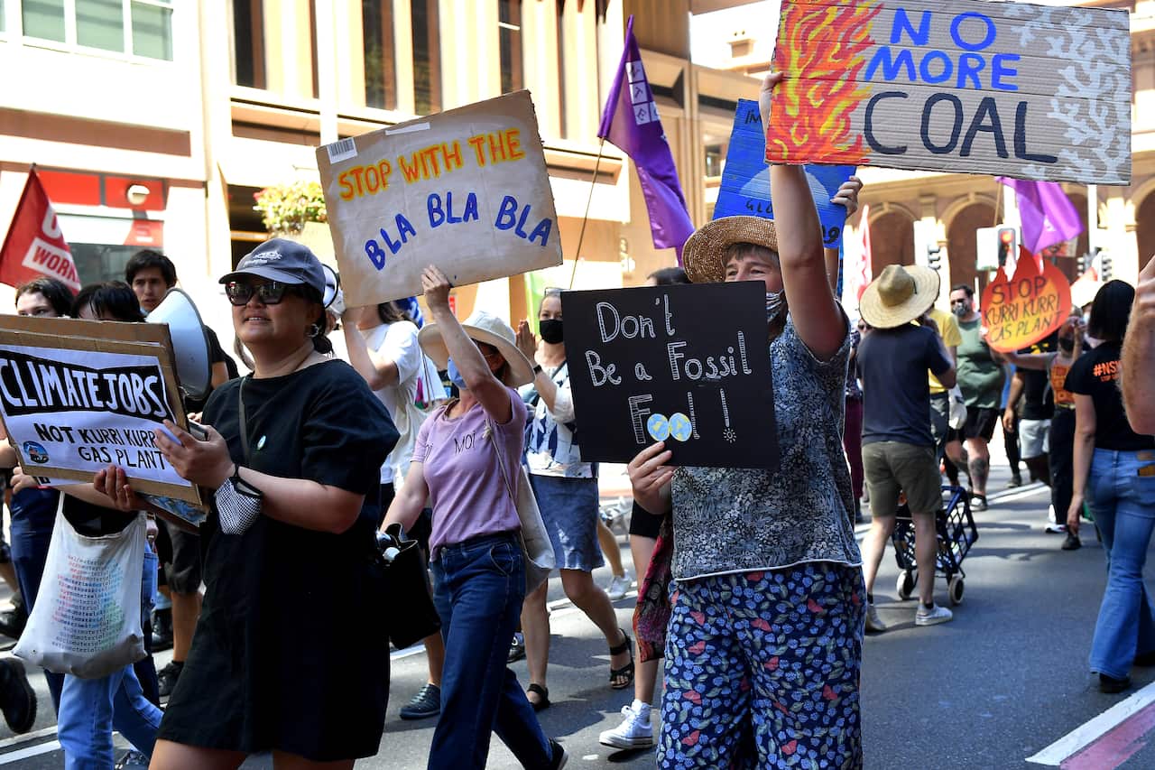Protesters are seen during a rally to mark the Global Day of Action on Climate in Sydney, Saturday, November 6, 2021