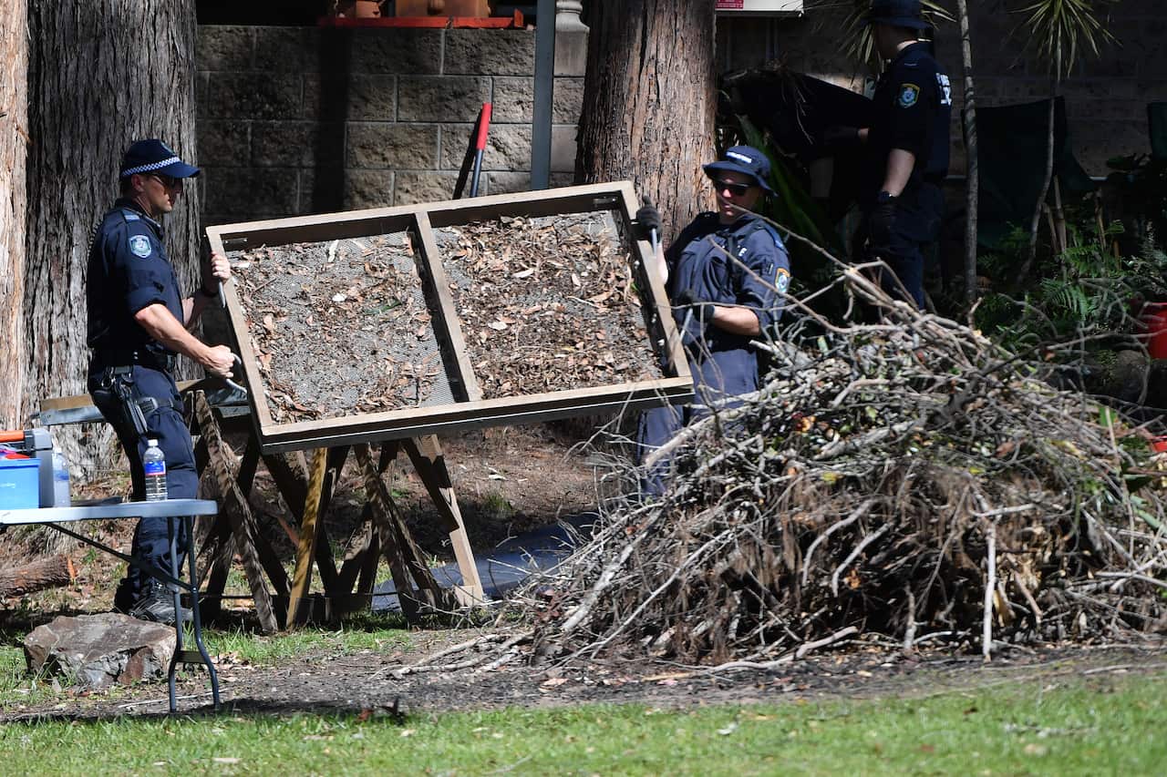 NSW Police sift debris from the front garden of William William Tyrrells foster grandmothers house in Kendall, mid north coast of NSW, Tuesday, November 16, 2021. Detectives are launching a new search for the remains of missing boy William Tyrrell, seven 