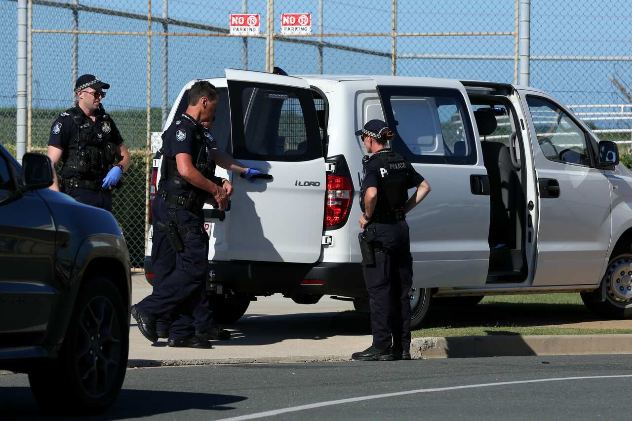 Queensland Police and Forensic teams are seen at the Scarborough Marina after a plane crashed into nearby waters, north of Brisbane, Sunday, December 19, 2021. Queensland Police have confirmed two adults and two children have been killed in a light plane
